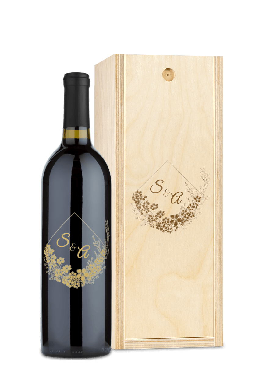 Wooden wine box engraved with a floral design and the monogram S & A on the lid.